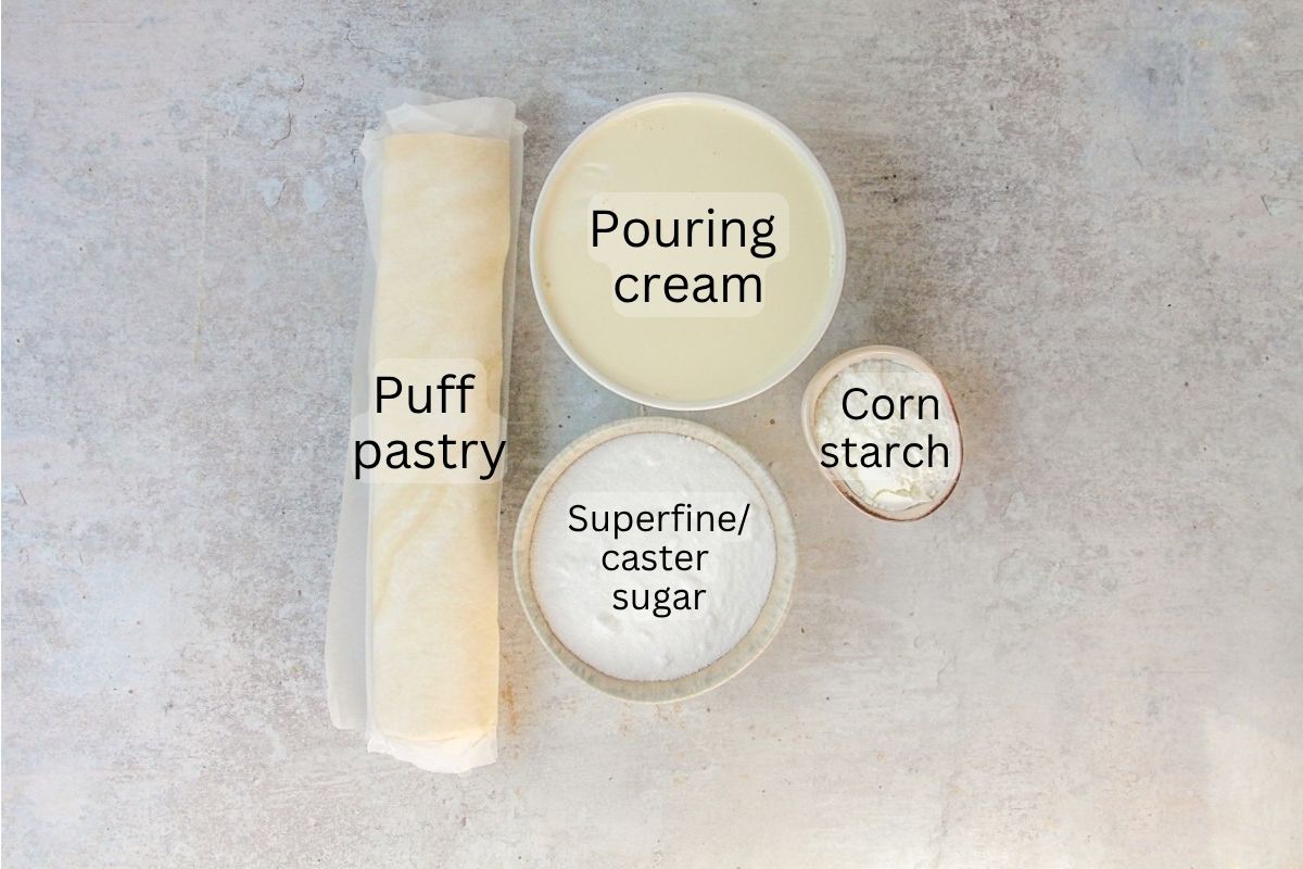 Ingredients for Belgian Cream Pie sit on a gray surface.