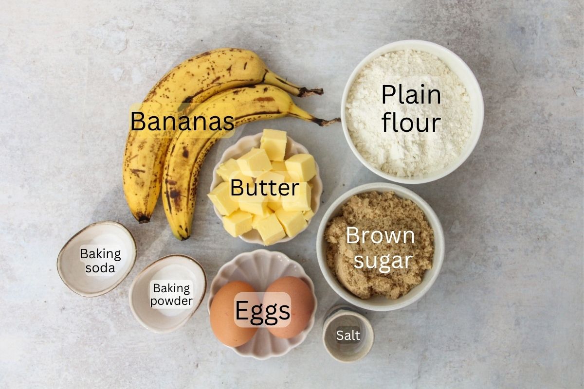 Ingredients for Banana Bread sit on a gray surface.