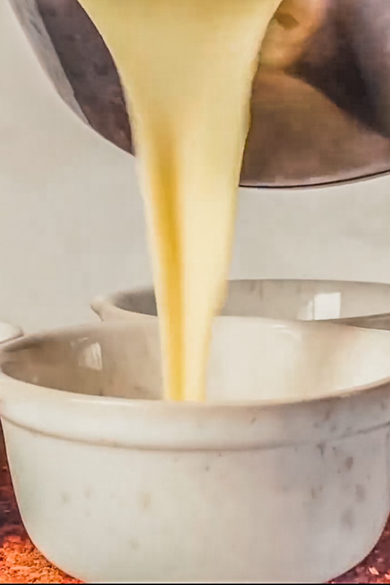 Crema Catalana is poured into individual ramekins.