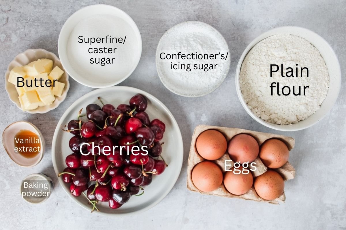 Ingredients for Czech Bublanina are laid out in a series of bowls on a light grey surface.