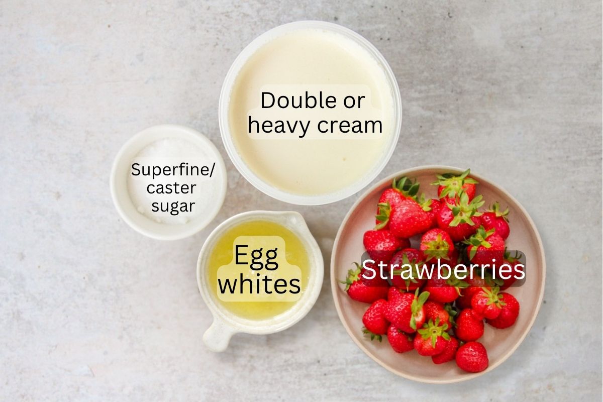 Ingredients for Eton Mess sit on a gray surface.