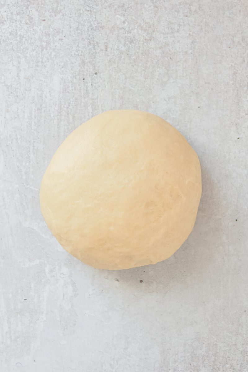 Babka dough sits on a gray surface.