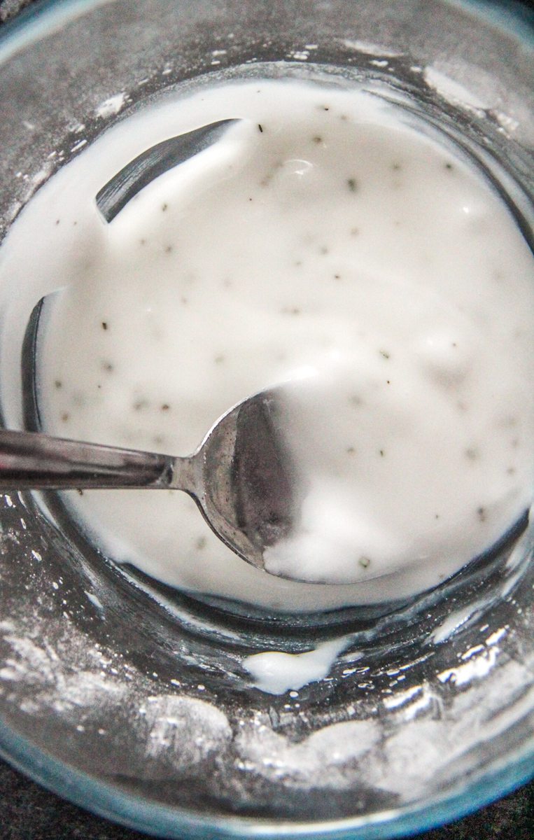 Rosemary glaze sits in a glass bowl.