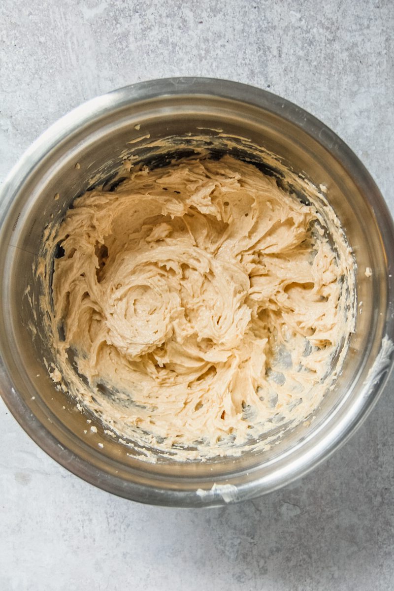 Cookie dough base sits in a stainless steel bowl on a gray surface.