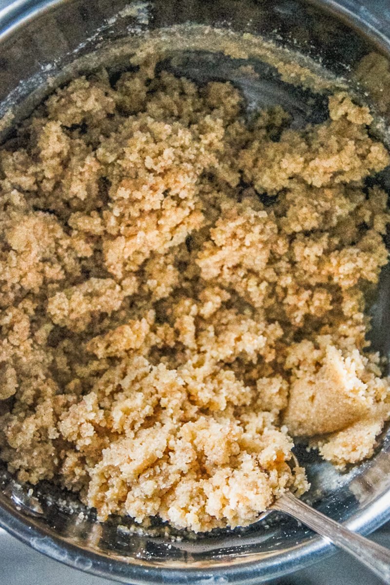 An almond mixture sits in a stainless steel saucepan.