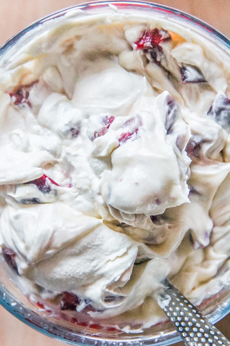 White chocolate and roughly cut cherries are stirred through a custard mixture.