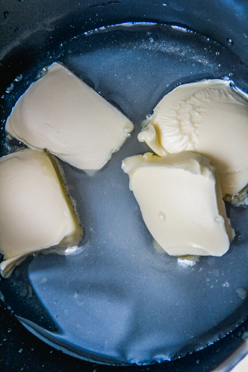 Butter and syrup sit in a saucepan.