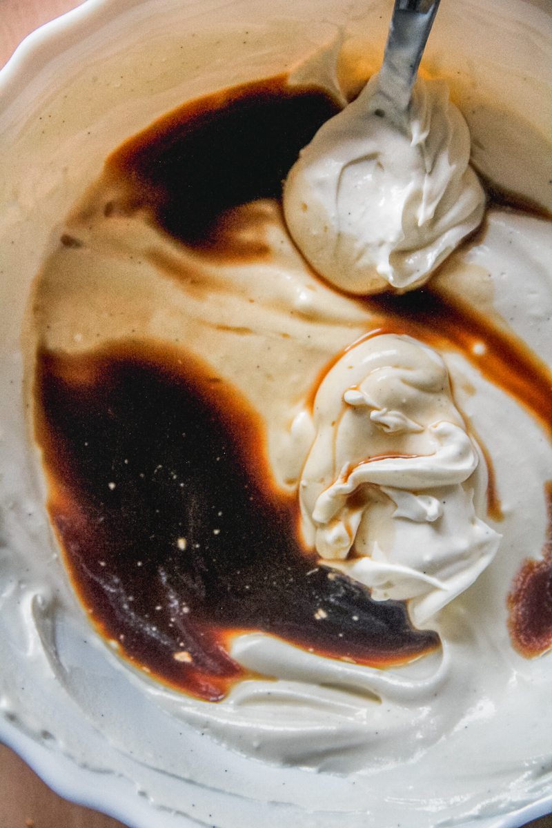 Coffee sits on a custard mixture in a bowl.