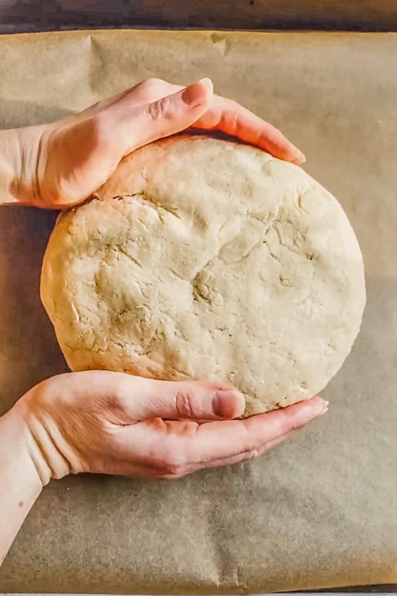 Native American Tortilla bread is placed onto a lined baking tray.