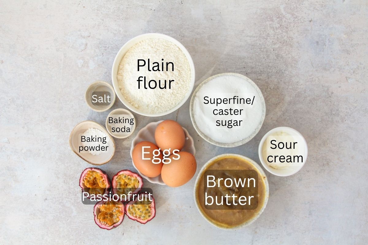 Ingredients for Passionfruit Cake sit on a gray surface.