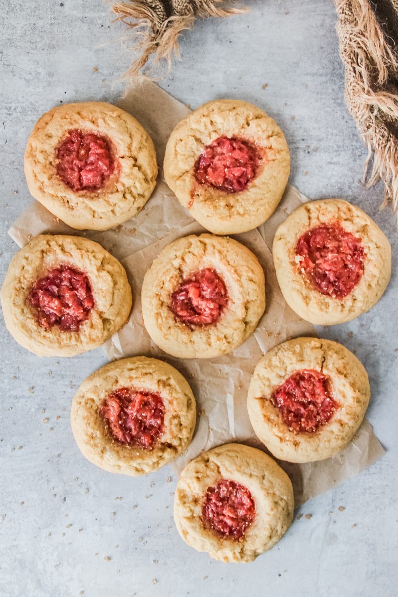 Peach muffin cookies sit on a light grey surface.