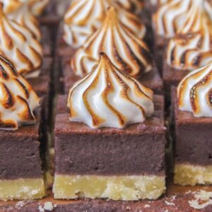 Sweet Potato Pie Bars sit on parchment paper.