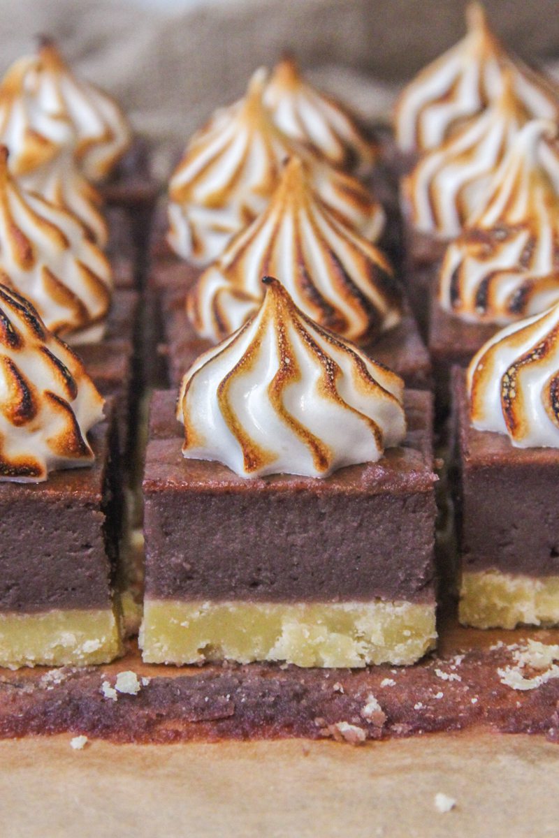 Sweet Potato Pie Bars sit on parchment paper.