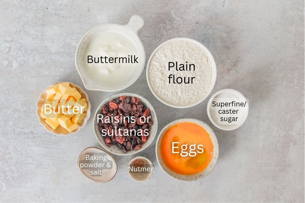 Ingredients for Teisan Lap - Welsh Wet Cake sit in a series of bowls on a gray surface.
