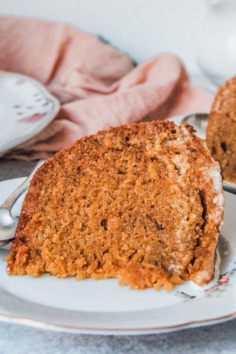 A serving of burnt sugar steam pudding is served up on an individual plate.